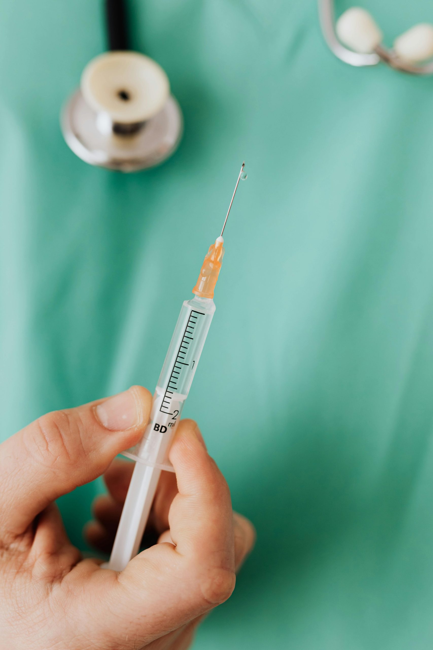 Close-up of a doctor holding a syringe ready for vaccination